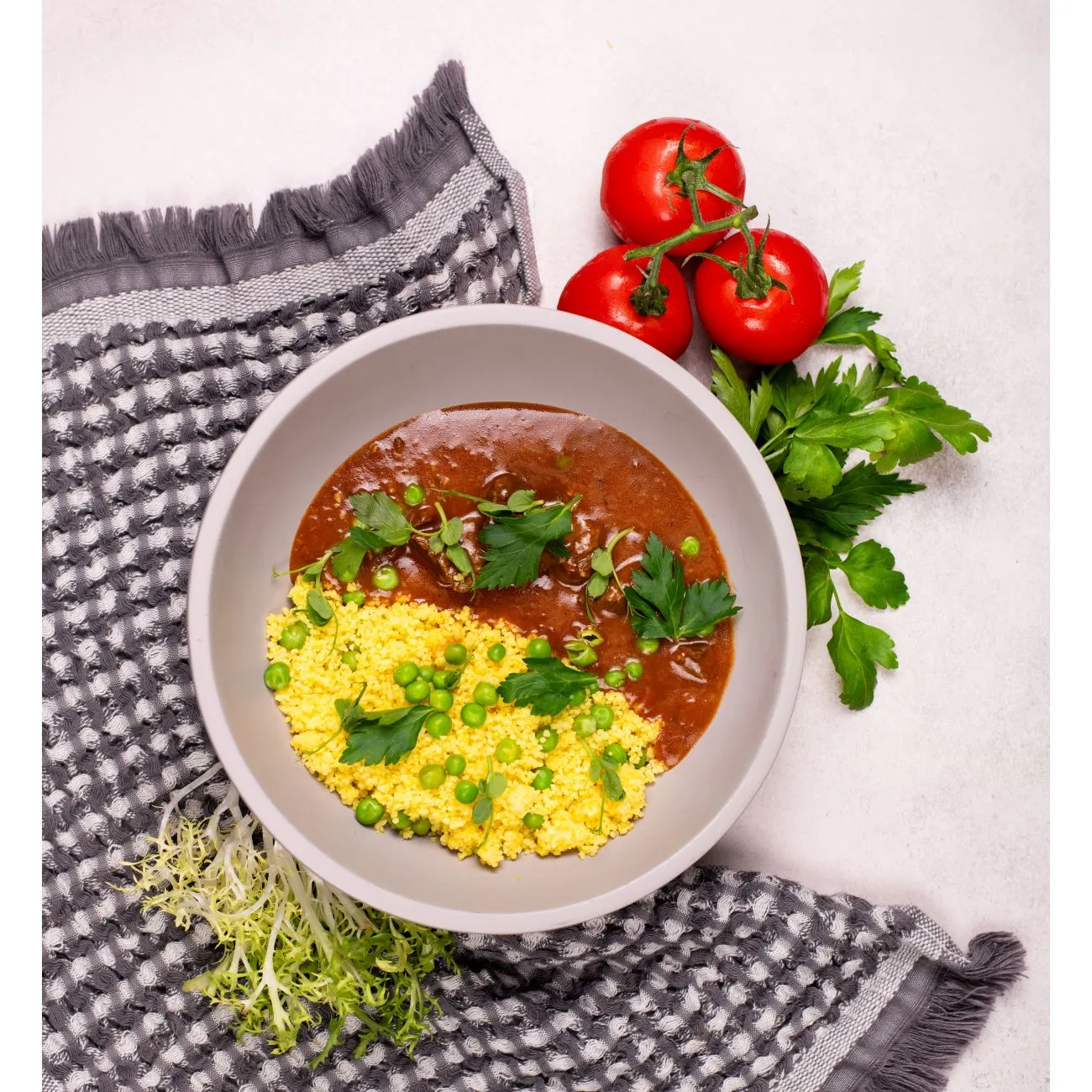 Beef tokan with peas and golden couscous