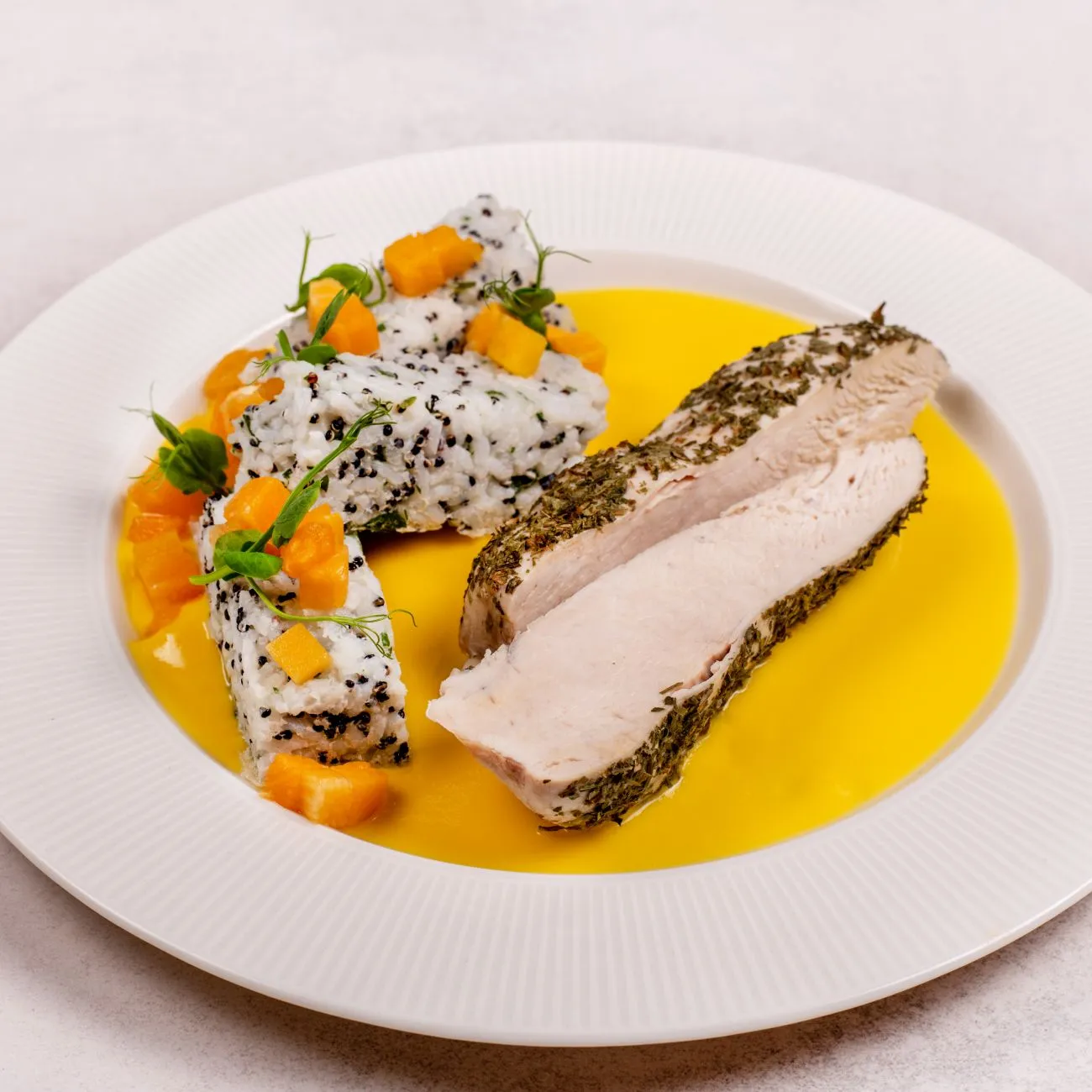 Chicken pieces in pumpkin sauce with rice and quinoa muffins